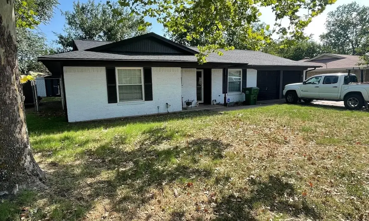 Professional roofing crew working on a residential roof in Richmond